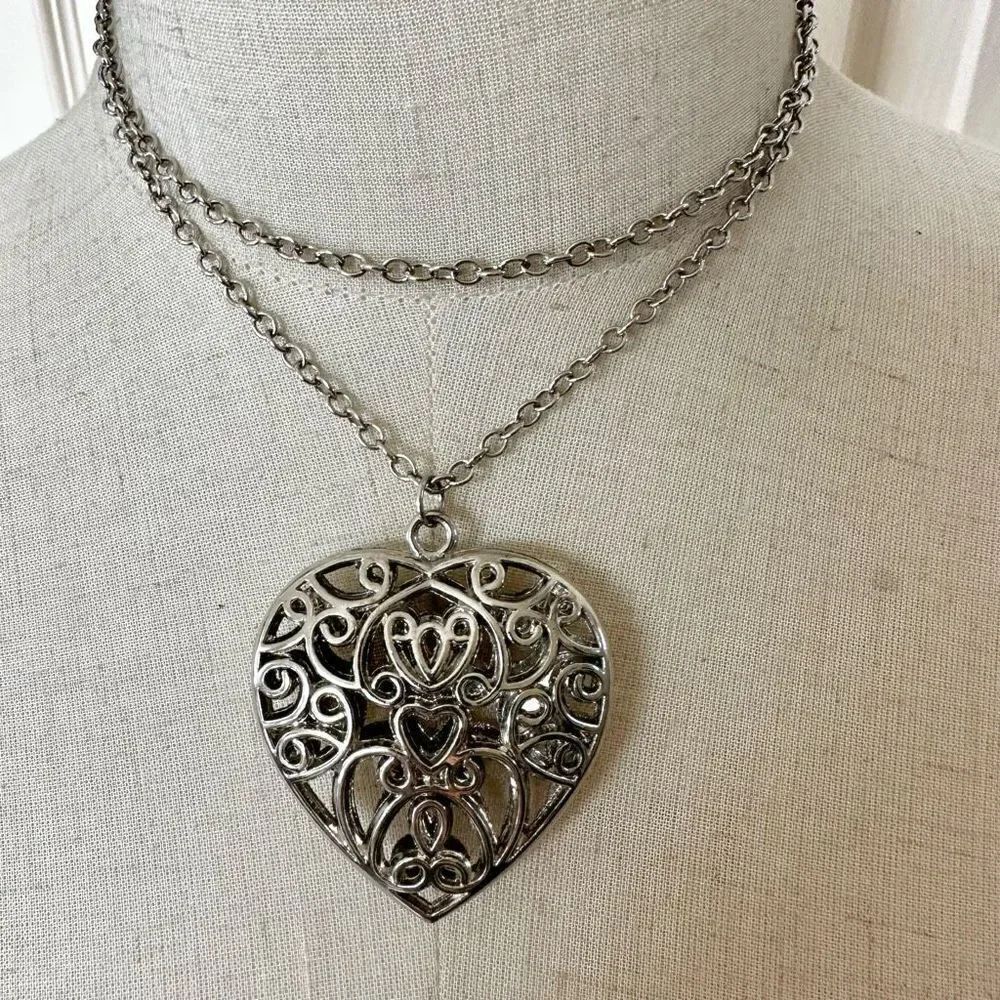 Silvertone puffy cut out heart pendant necklace